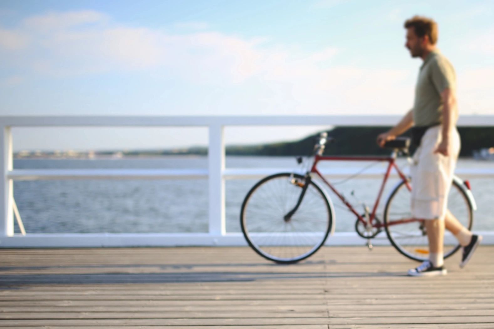 windham bike accident lawyer takes photo of bicyclist on boardwalk